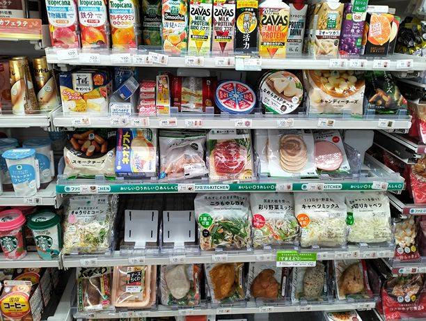 Salad and proteins are arranged in one section at Japanese convenience store.