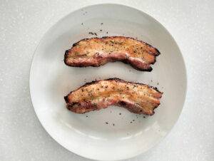 Air fried Pork Belly Strips on the white plate