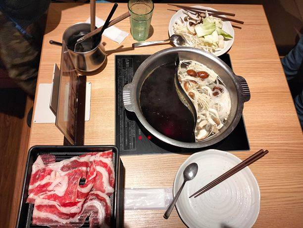 Sukiyaki, similar to Shabu-shabu. Free flow meat.