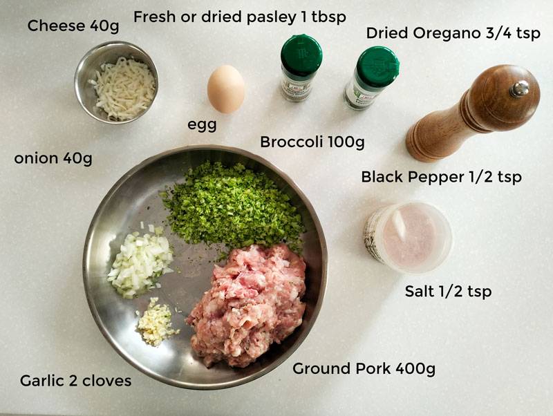 Ingredients needed for the recipes. Cheese, egg, pasley, oregano, black pepper, salt, minced onion, minced garlic, minced broccoli, ground pork