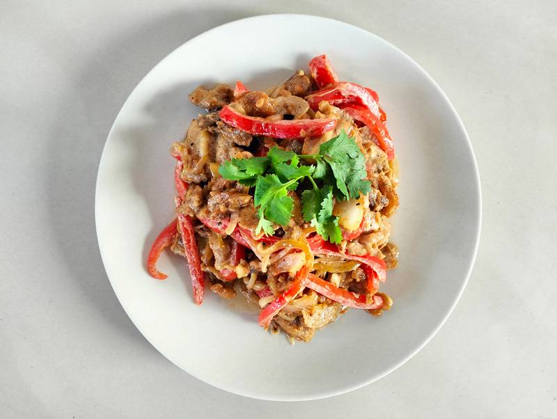 cooked pork dish on a white plate