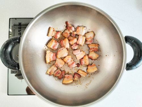 searing meat using a stainless steel wok