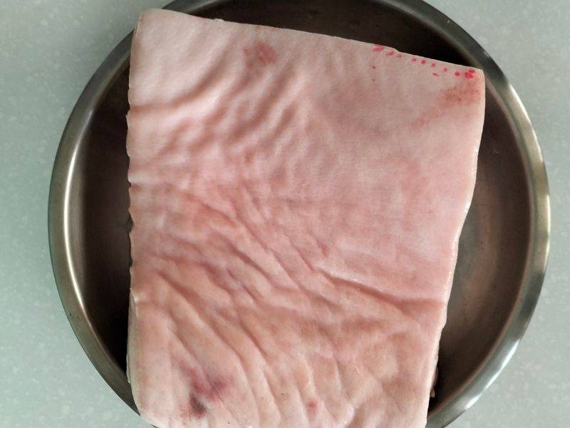 pork belly on stainless steel pan